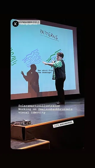 A designer presenting a visual identity on stage